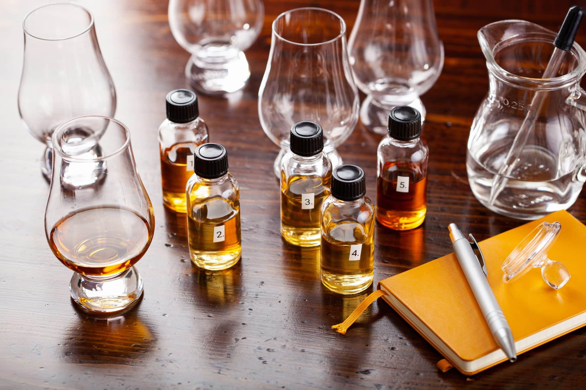 tasting bottles and glasses of whisky spirit brandy cognac. tasting at home