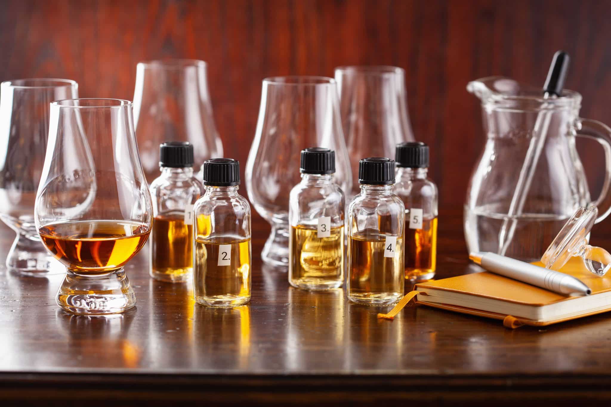 tasting bottles and glasses of whisky spirit brandy cognac. tasting at home
